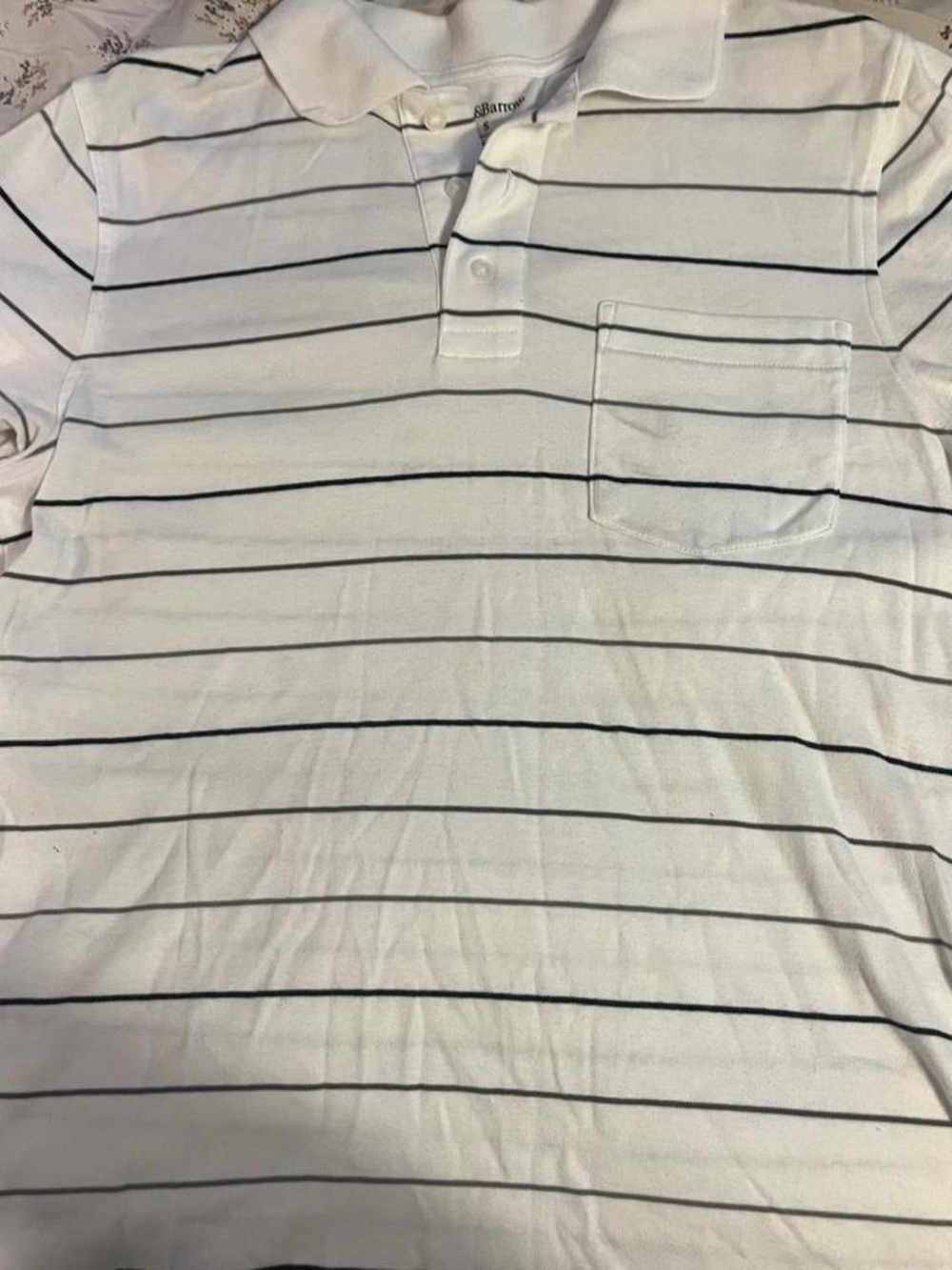 white and black striped polo shirt